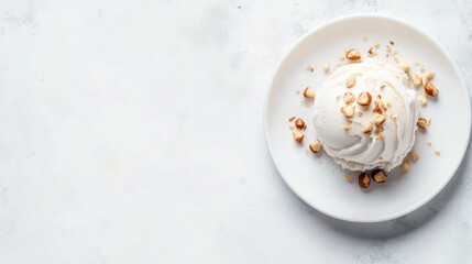 A close-up view of rich hazelnut gelato served in a small white dish, topped with crushed hazelnuts for added texture and appeal