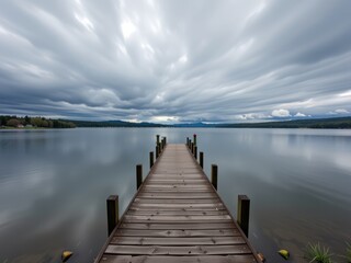Fototapeta premium Serene Lake Dock Calm Water Dramatic Cloudscape Peaceful Nature