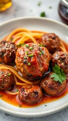 Fototapeta premium Closeup of meatballs and spaghetti with tomato sauce dish, a classic Italian meal