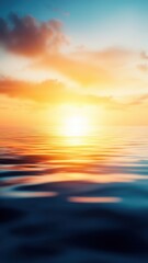 A serene sunset reflecting on calm waters, creating a beautiful blend of warm colors and soft ripples.
