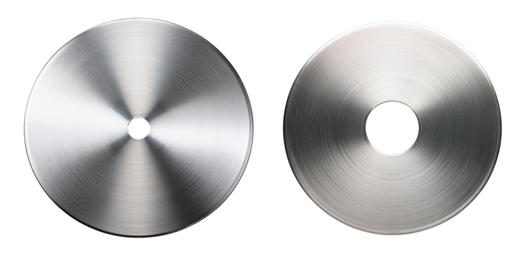 Close-up of two stainless steel discs highlighting metallic texture and precision.