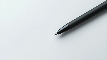 Closeup of a black ballpoint pen on a white background