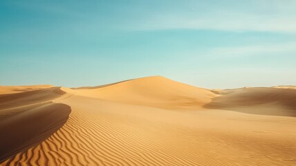 A serene desert landscape with golden sand dunes under a clear blue sky, showcasing the beauty of nature's vastness.