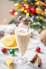 Pina colada. Fresh  cocktail with coconut and pineapple on christmas decoration