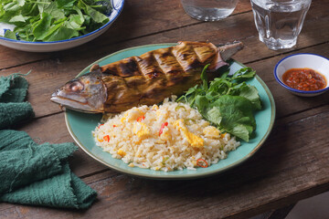 Ikan Bakar is a popular Malaysian dish where fish, typically marinated with spices and herbs, is grilled over an open flame.