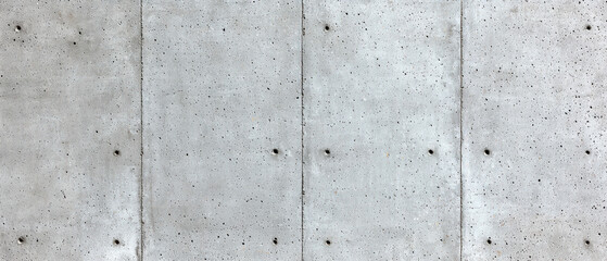 Concrete construction. Concrete wall with a textured surface and visible seams.