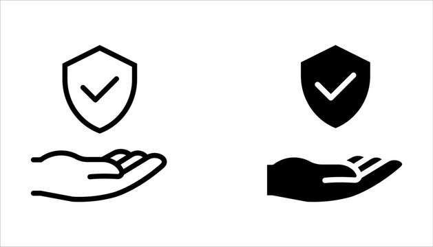 Insurance hand icon set. Shield with checkmark on hand symbol. Protection icon on white background