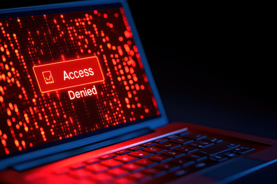 Access denied message displayed on laptop screen with red background, symbolizing security and privacy issues