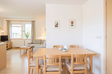 Living and dining area table chairs blueberries teapot cups