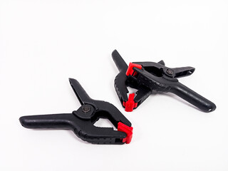 Obraz premium black plastic clamp isolated on white background, for industrial manufacturing plastic product catalog design