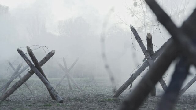WWI scene of a soldier leaving the trenches during a Christmas truce, approaching enemy lines in no man's land between tank barriers and barbed wire, highlighting fragile humanity in war.