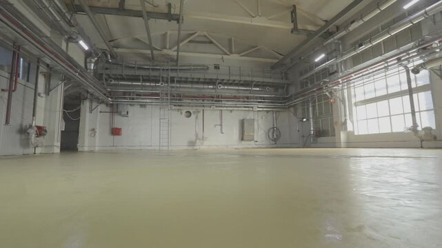 Empty production hall after renovation, from the inside. Large factory shop from the inside. 