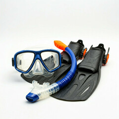 blue and orange diving mask and fins on white background
