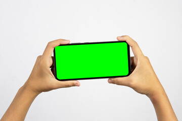 Hand holding smartphone with blank screen isolated on white background