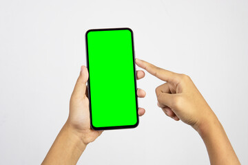 Hand holding smartphone with blank screen isolated on white background