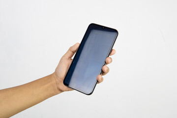 Hand holding smartphone with blank screen isolated on white background