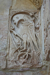 A historical building framed with artistically carved stonework. Architectural detail from the...