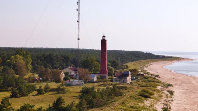 Aerial landscape of Beach environment in Latvian coast, forested Lighthouse area, sea building construction