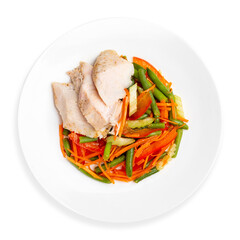 Chicken breast with vegetables, on a white background, isolated. Top view.