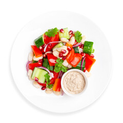 Fresh vegetable salad on a white background, isolated. Top view.