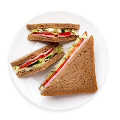 Sandwich of black bread with ham and vegetables, on a white background, isolated. Top view.