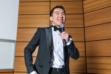 Young man giving a speech as the emcee of an event