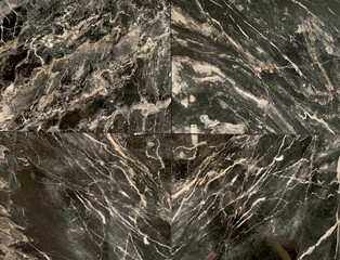 Black marble with gold brown veins.  Gold dragon black marble, golden veins and grains. Seamless marble background texture