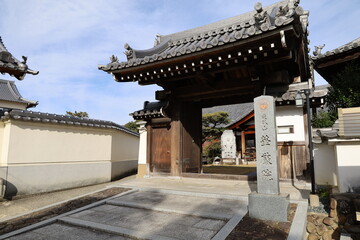 Fototapeta premium A Japanese temple : a scene of the entrance gate to a subordinate one in the precincts of Kumeda-dera Temple in Kishiwada City in Osaka Prefecture 