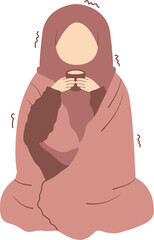 Woman wearing a blanket and drinking a cup of warm tea to get rid of the cold
