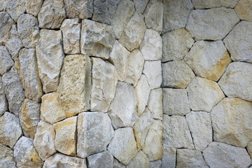 A collection of irregularly shaped stones in a wall. An ideal concept for a natural background