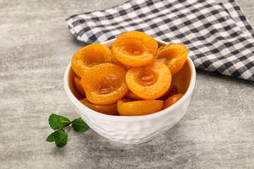 Sweet canned apricots with syrope
