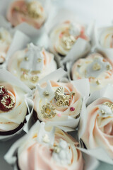 Delicious sweet buffet with cupcakes and macaroons. Luxury Candy Bar for celebration, wedding, birthday