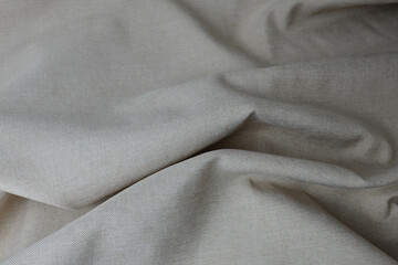 Abstract textured background with cream grungy textile folds, perfect for design applications