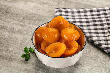 Sweet canned apricots with syrope