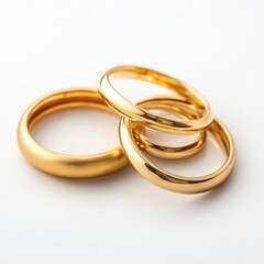 Elegant gold rings on white background: minimalist jewelry design