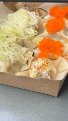 Chinese style steamed dumplings Garnish with cheese and Japanese scallions. and Japanese style shrimp eggs.
