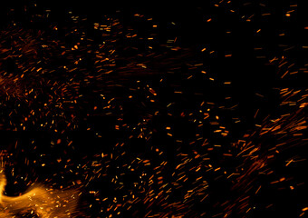 fire flame with sparks on black background.