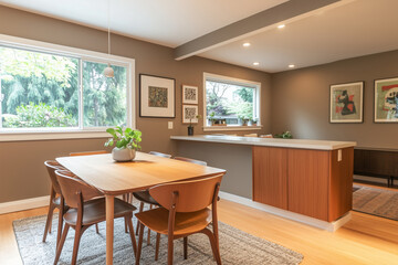 A light oak dining table and chairs sit against a soft beige wall, complemented by a minimal white countertop kitchen. The mid-century Scandinavian home 