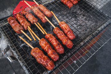 Pork sausage, cooked on a barbecue grill. Street food
