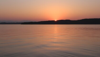 Obraz premium Serene Sunrise over a Calm Lake