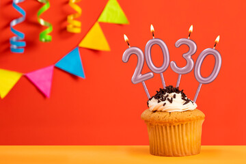 Candles number 2030 for happy new year - New years eve celebration on orange background