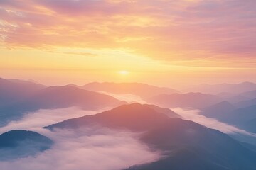Plane is flying over mountain peaks in low clouds at golden sunrise. Top view of passenger airplane, colorful sky, hills in fog. Aircraft is taking off. Business travel. Commercial. Aerial view