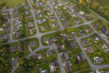 View of a small European town from a drone. Many private and residential houses. A cozy place to live with developed infrastructure.
