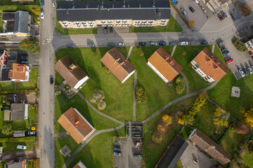 A series of low and cozy residential buildings in Europe. Old housing stock with well-organized courtyard infrastructure. Aerial view, drone shot.