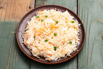 Tasty marinated cabbage with carrot, healthy food  Sauerkraut photography . Top view