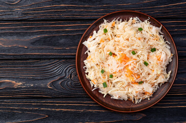 Tasty marinated cabbage with carrot, healthy food  Sauerkraut photography . Top view