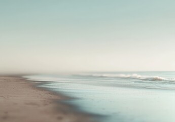 Serene beach at sunrise, soft sand, gentle waves, hazy sky.