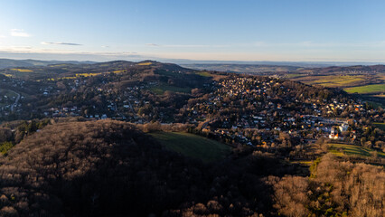 Obraz premium Aerial View of Austrian Villages and Wild Forests: Drone Footage of Austria's Untouched Nature, showcasing the breathtaking beauty of remote landscapes.