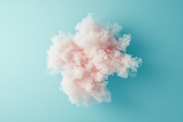 Fototapeta premium A fluffy cloud with a mix of pink and white hues floats against a light blue background, offering a dreamy, ethereal feel with hints of whimsy and imagination.