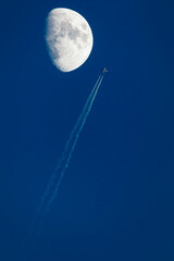 Fototapeta premium Flying plane and crescent moon.